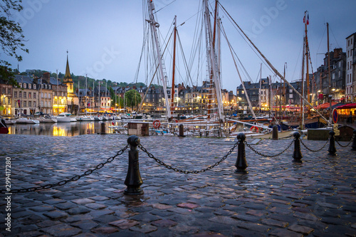 Canvas Print stone embankment in Honfleur port with yachts in the evening