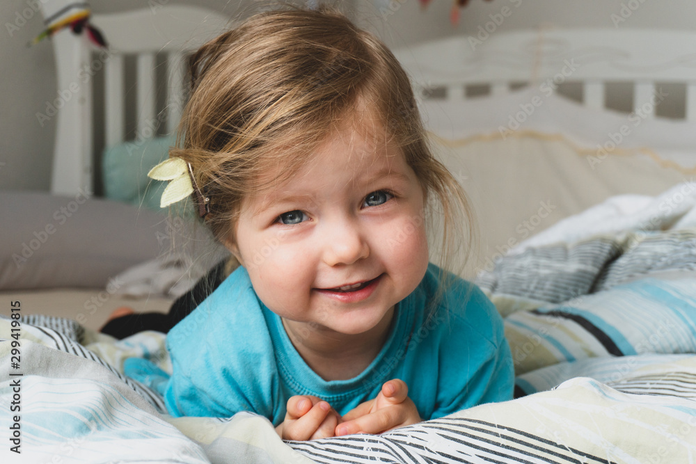 Beauty little cute girl lookin in camera and smiling Beauty little cute girl lookin in camera and smiling