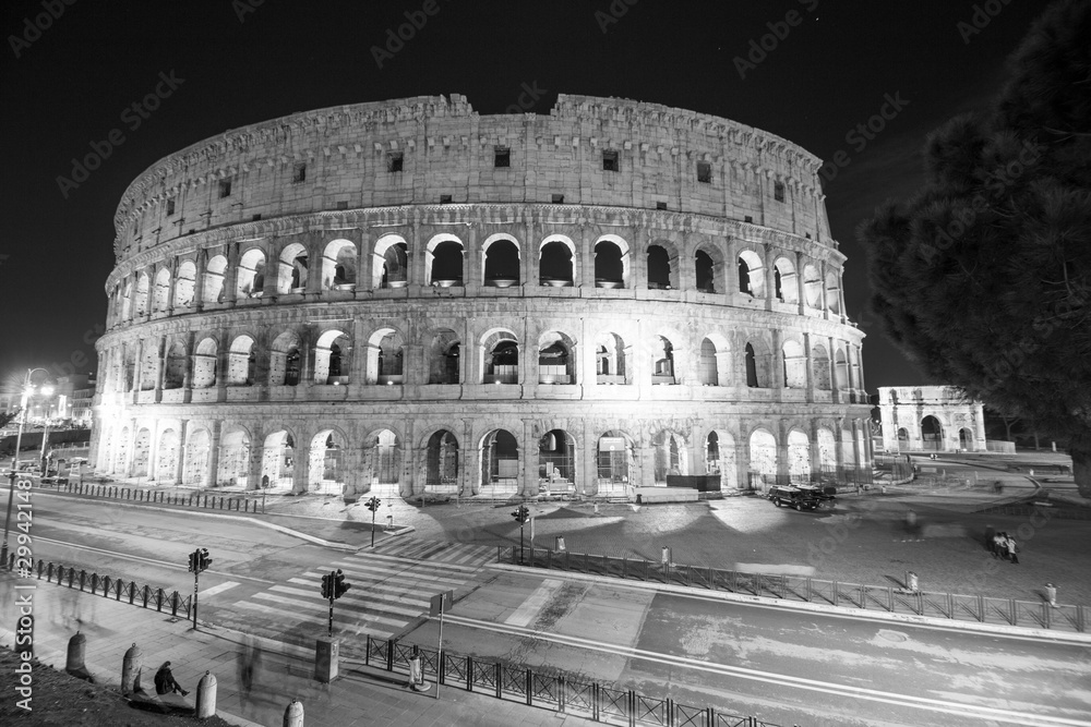  Colosseum, Rome, Italy. Night view of Colosseo in Rome, elliptical largest amphitheatre of Roman Empire ancient civilization