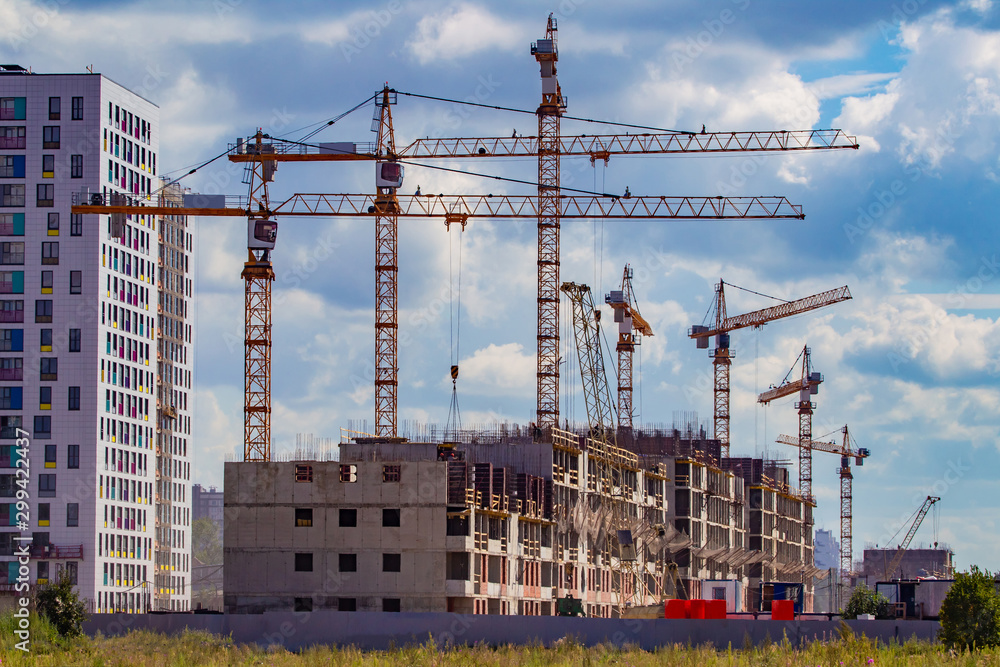 Construction. Building a new area. Cranes during operation. Highrise