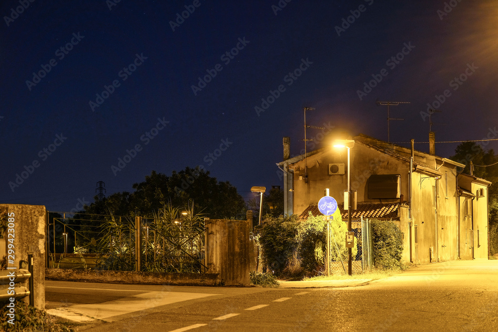 Ferrara, Italy - July, 17, 2019: image of a night street in Italy