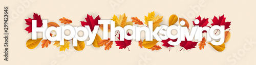 happy thanksgiving banner with dried leaves decoration photo