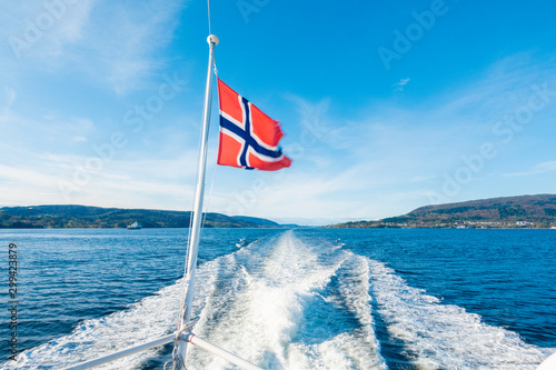 Photography Norway flag on Ferry cruise with blue sky