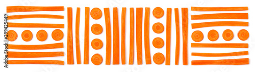 Creative layout of sliced carrot. Vegetable pattern. Food background isolated over white. Flat lay, top view. Banner..