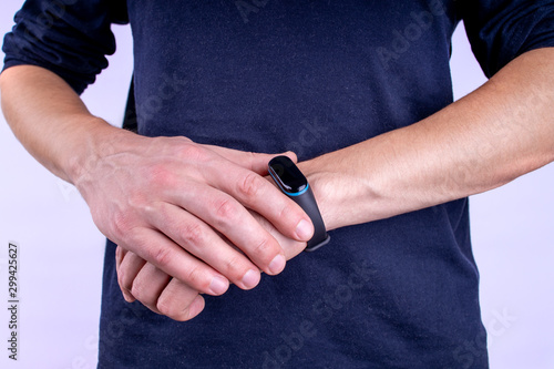 fitness tracker on person hands. wearing exercise gadget.