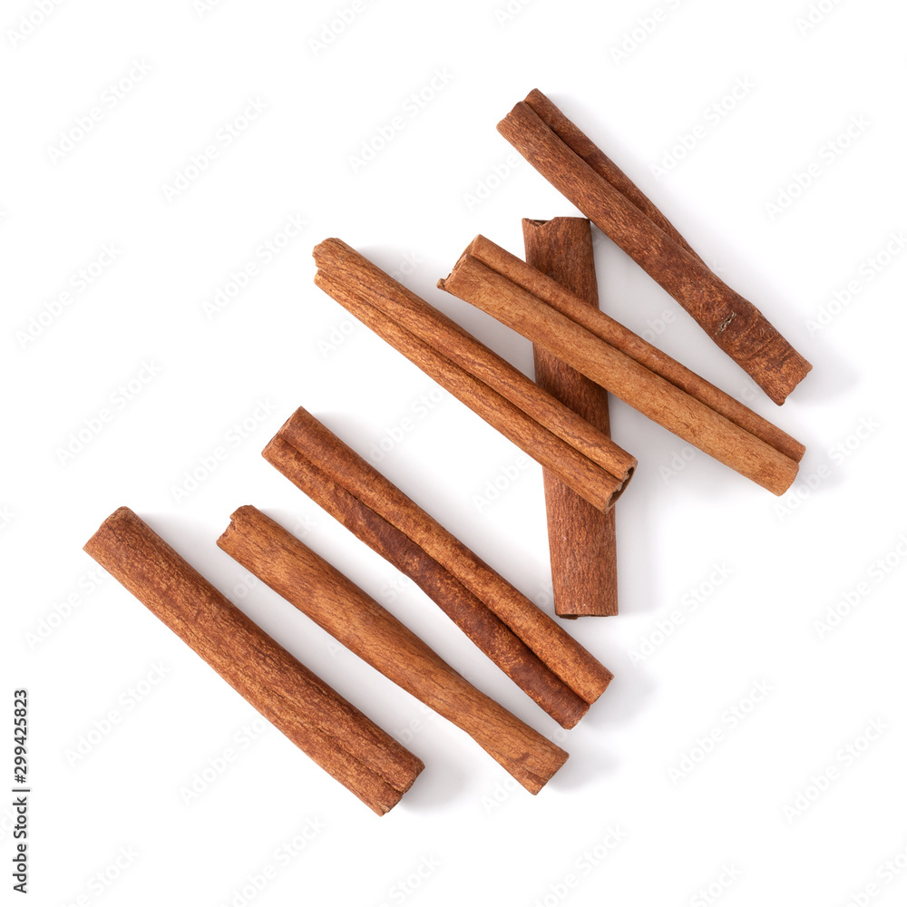 Cinnamon sticks isolated over white background closeup. Canella spice. Aromatic condiment background. Flat lay, top view..