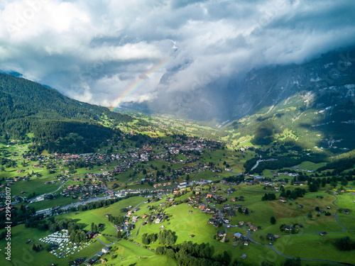 Sun shines over Swiss village Grindelwald after heavy storm in summer time near Swiss Alps