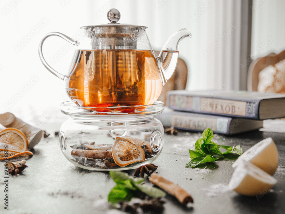 Tea in a glass teapot on the light background Tea in a glass teapot on the light background