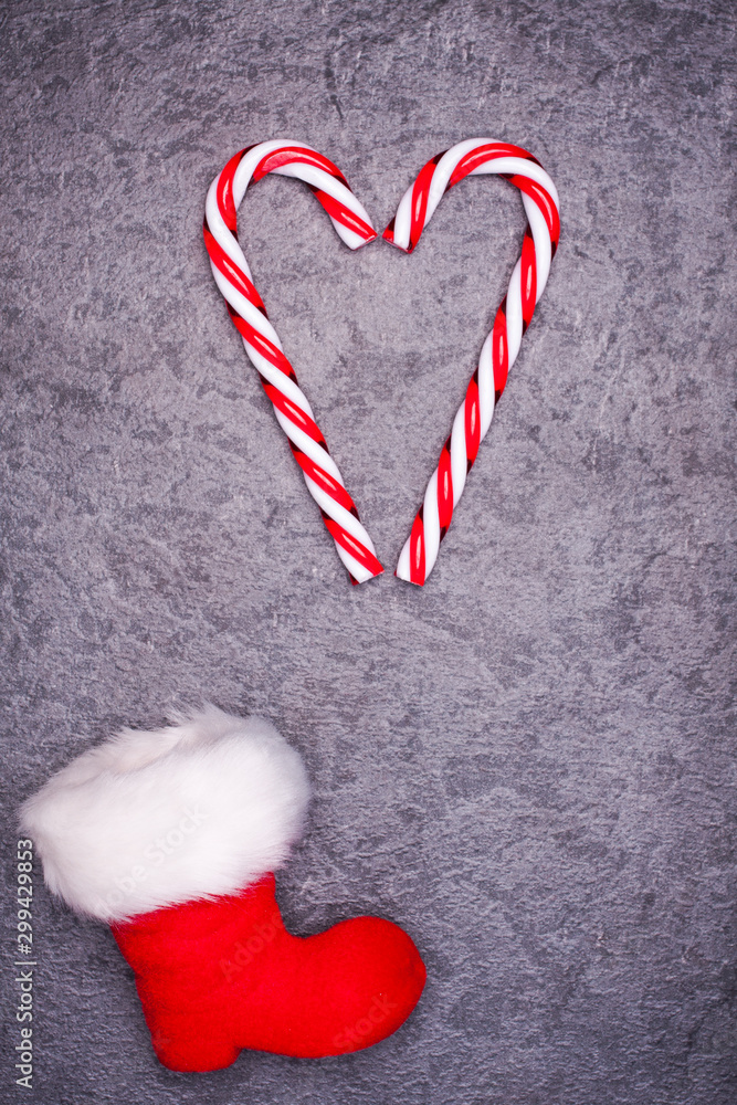 Christmas greeting card. Noel festive background. New year symbol. Santas shoes.