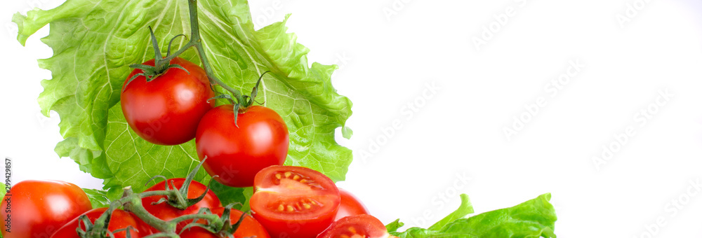 ripe tomatoes with lettuce leaves on a white background ripe tomatoes with lettuce leaves on a white background