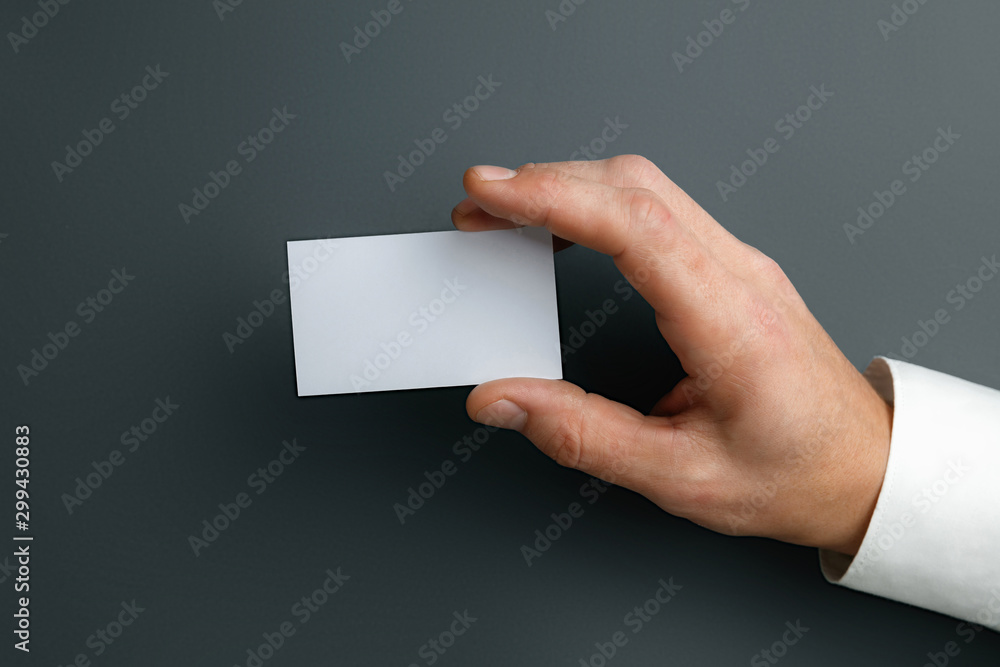 Male hand holding a blank business card on grey background for text or  design. Blank credit card templates for contact or use in business.  Finance, office. Mock up. Copyspace. Stock Photo |