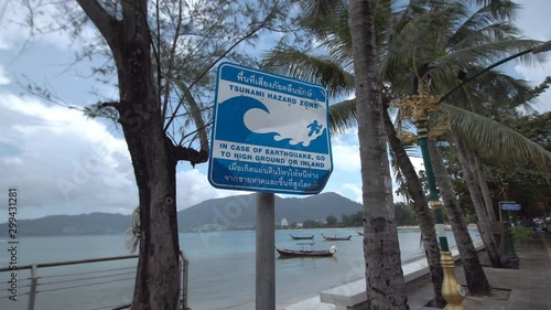 Tsunami warning sign on street at Patong beach in Phuket, Thailand. 
