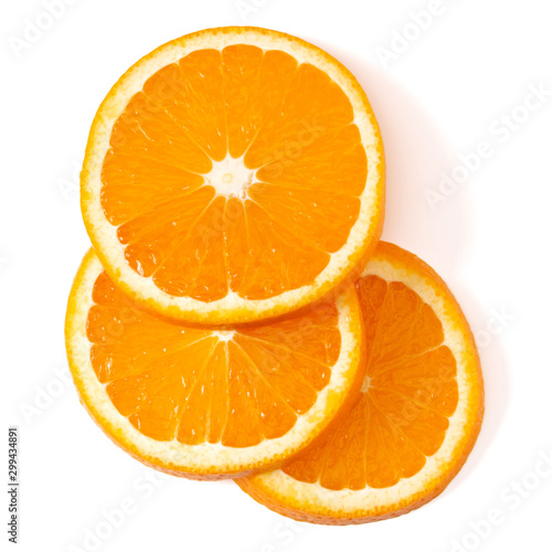 Orange fruit slice layout isolated on white background closeup. Food background. Flat lay, top view.