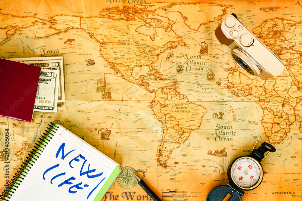 Old paper world map, as a travel background, and accessories for a photographer to work as a digital nomad. Old paper world map, as a travel background, and accessories for a photographer to work as a digital nomad.