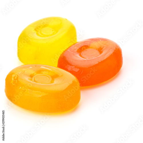 Three colorful fruit hard sugar candies,  boiled sweeties or sugar plums isolated on white background cutout photo