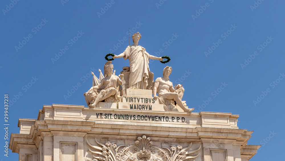 Obraz premium Allegorical sculpture atop the Arco da Rua Augusta overlooking the Praça do Comércio in Baixa, Lisbon City Centre.