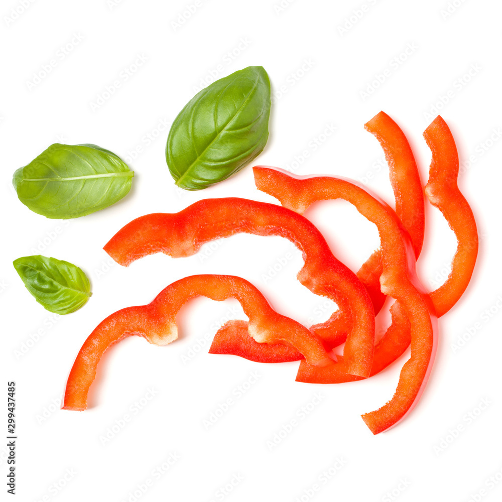 red pepper slices with basil leaves isolated on white background cutout. Top view, flat lay. red pepper slices with basil leaves isolated on white background cutout. Top view, flat lay.