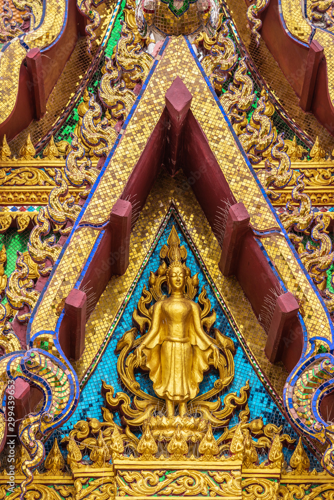 Ko Samui Island, Thailand - March 18, 2019: Wat Laem Suwannaram Chinese Buddhist Temple. Golden statue of Guan Yin in Elaborately decorated full of colors front facade.