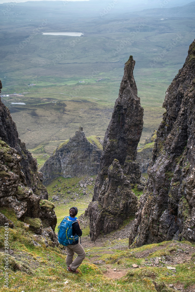 Lone woman hiking around the Needle, Quiraing, Isle of Skye, Scotland