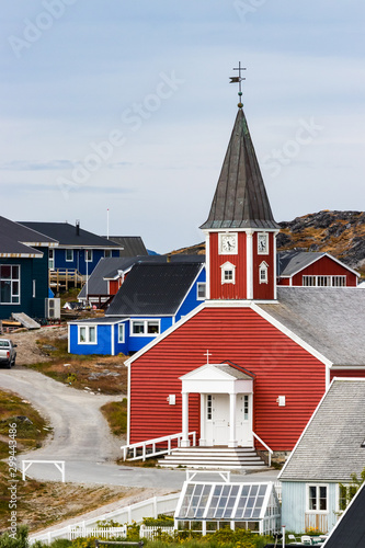 The Cathedral of Our Saviour Annaassisitta Oqaluffia and colorful houses in Nuuk, Greenland. photo