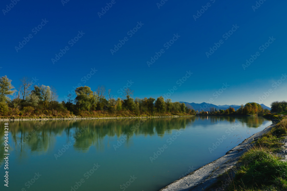 The Inn River near Rosenheim in Upper Bavaria, in autumn. In the background the Alps.