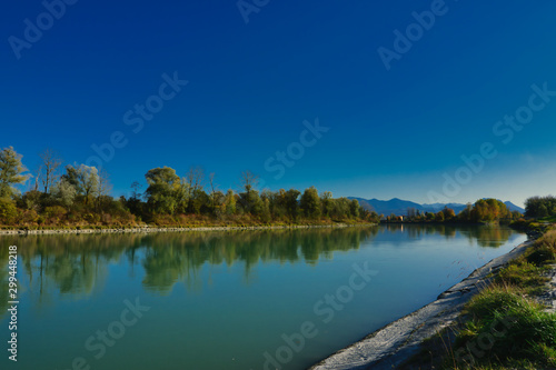 The Inn River near Rosenheim in Upper Bavaria, in autumn. In the background the Alps.