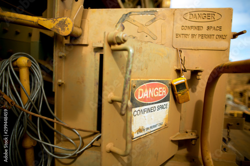 Fotografie Danger tag confined space sign entry  authorised personnel by permit only with g