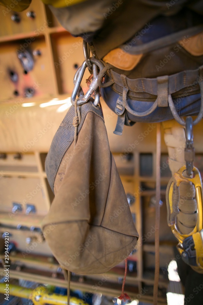 Rope access equipment accessories brawn safety tool dropped object  prevention pot bag hanging on the side of inspector abseiler safety harness  loop at construction site Perth, Australia Photos | Adobe Stock