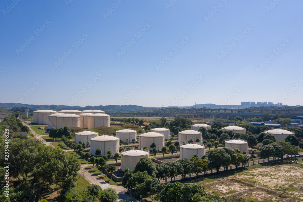 Aerial view and skyline view of large storage tanks in urban factory area