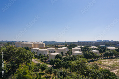 Aerial view and skyline view of large storage tanks in urban factory area