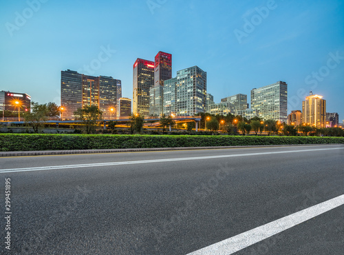 Asphalt highway and modern business district office buildings in Beijing at night, China © hallojulie
