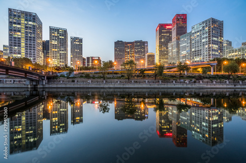 Business district office buildings and water reflection in Beijing at night © hallojulie