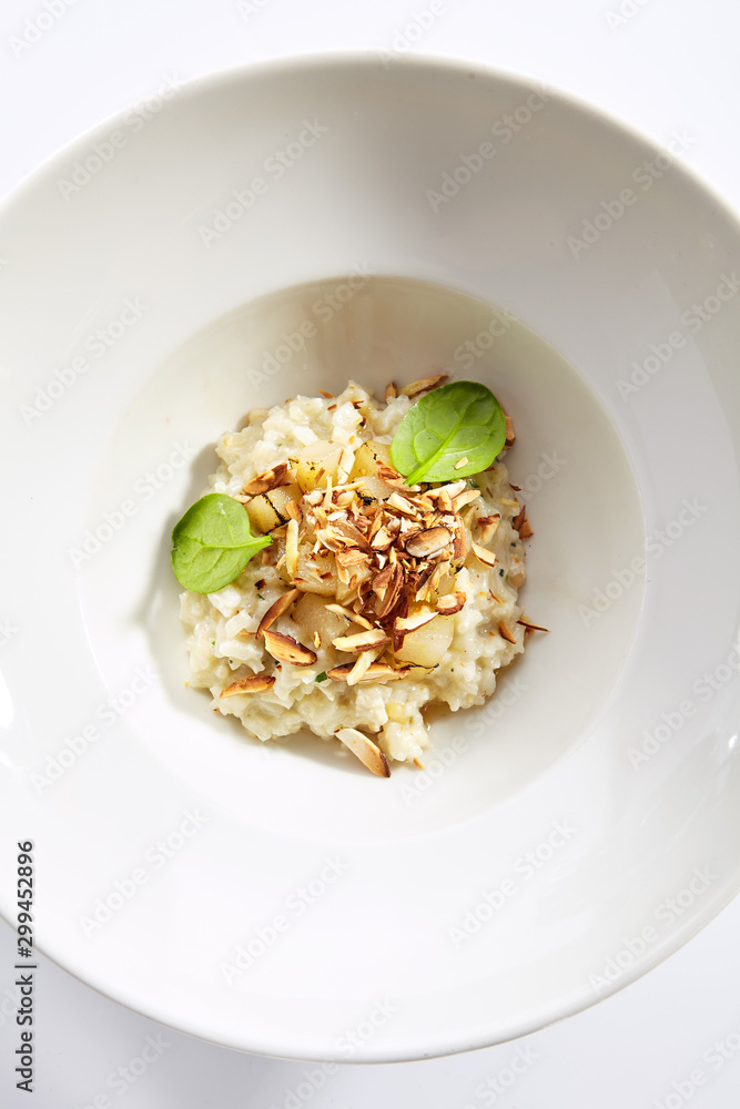 Risotto with roasted pear and almond top view Risotto with roasted pear and almond top view