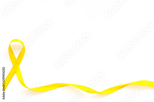 Disease control concept. Yellow ribbon on white background top view space for text