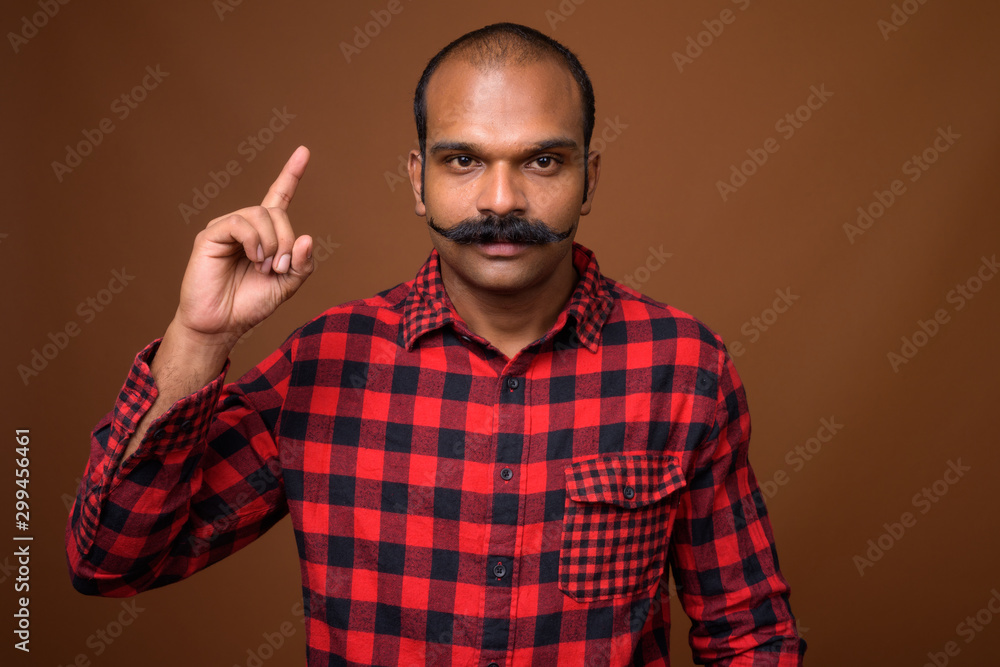 Portrait of Indian hipster man with mustache Portrait of Indian hipster man with mustache