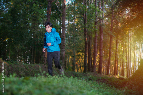 The runner running in the forest © thanarak