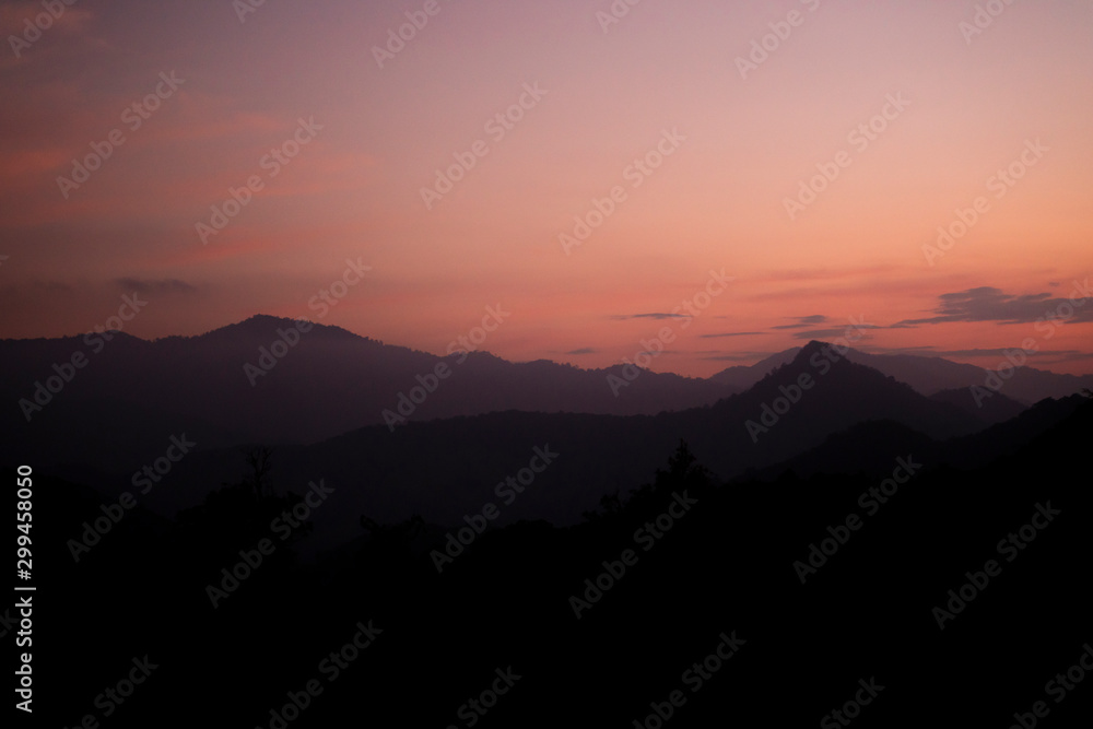 The high mountain with the sunset sky