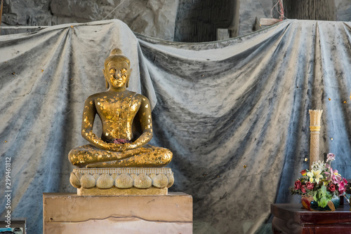 Suphan Buri, Thailand - October 27, 2019: Buddha statue of Buddha carved cliff and Flying Dragon Cave, Khao Tham Thiam, U Thong City Historic Site at Suphan Buri, Thailand photo