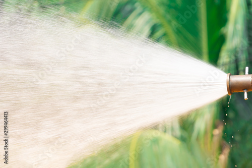 Close-up water flowing out of pipe with high pressure