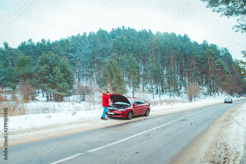 man standing near broken car at roadside snowed winter weather © phpetrunina14