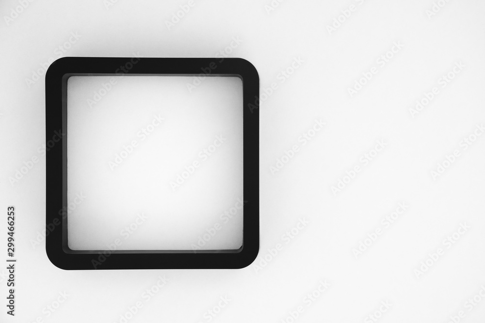 black frame on white color background, copy space, contrast and opposite concept black frame on white color background, copy space, contrast and opposite concept