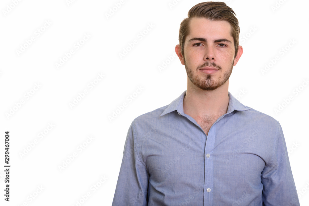 Portrait of young handsome bearded businessman looking at camera Portrait of young handsome bearded businessman looking at camera