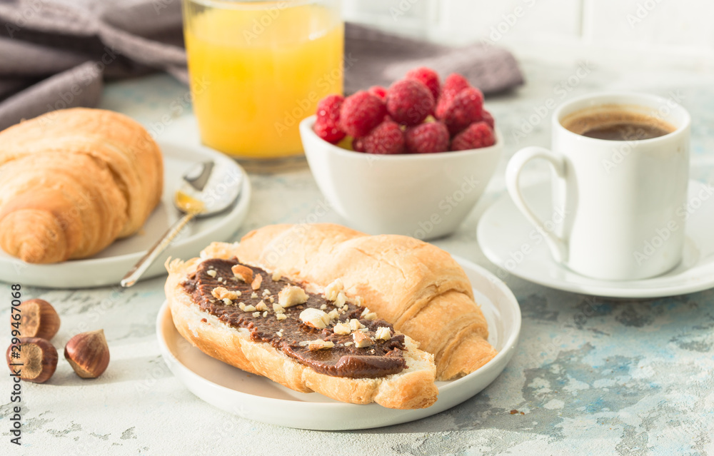 breakfast with croissants and berry, orange juice. fresh crispy croissants and coffee on a light background, top view/ breakfast with croissants and berry, orange juice. fresh crispy croissants and coffee on a light background, top view/
