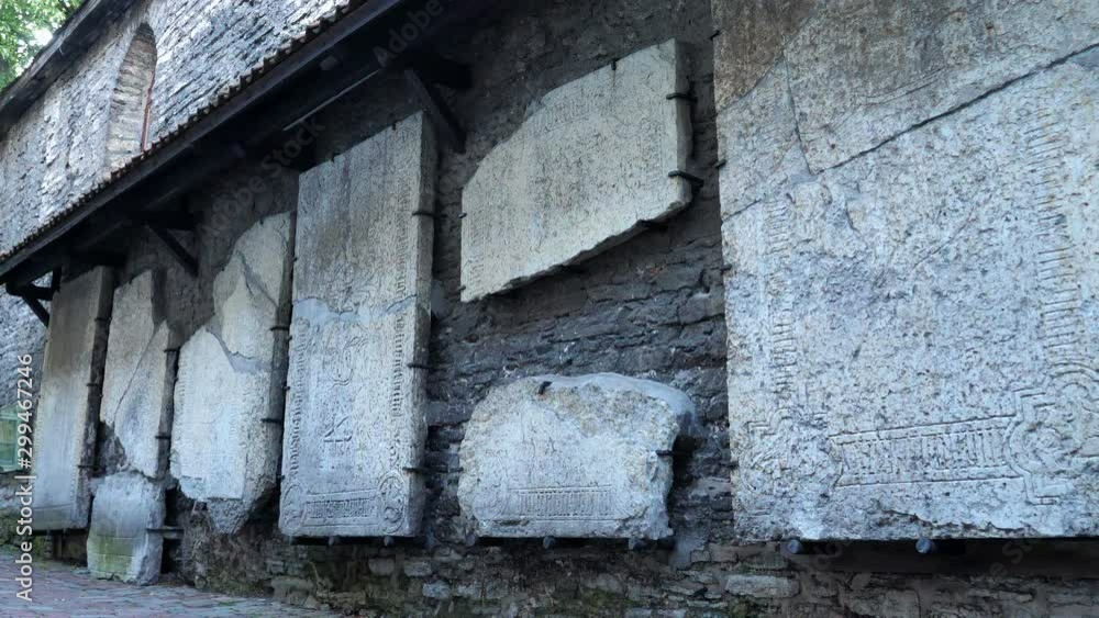 Historic tombstones on the wall of Saint Catharine's Passage in Tallinn. Panning shot right. Historic tombstones on the wall of Saint Catharine's Passage in Tallinn. Panning shot right.