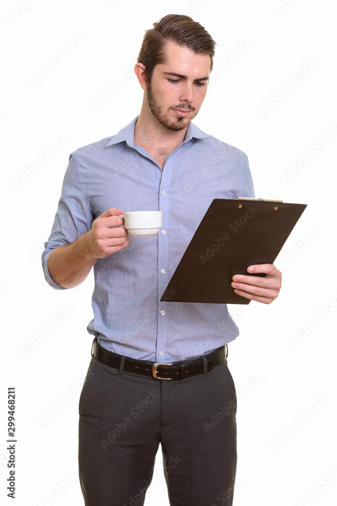 Portrait of young handsome bearded businessman with clipboard Portrait of young handsome bearded businessman with clipboard