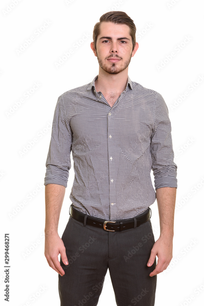 Fototapeta premium Portrait of young handsome bearded businessman looking at camera