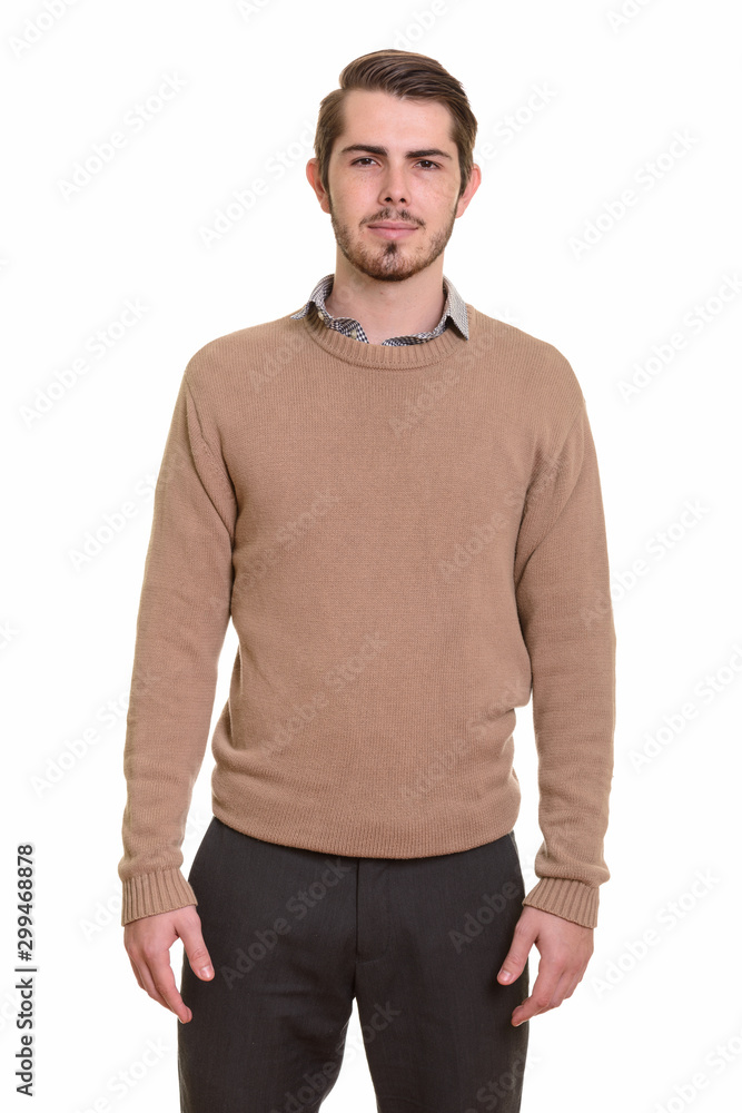 Portrait of young handsome bearded man looking at camera Portrait of young handsome bearded man looking at camera
