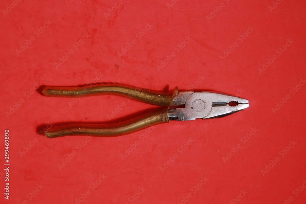 old pliers in color background