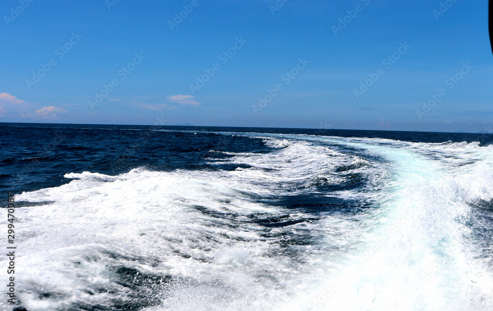 boat ride on the sea, exotic James Bond islands against the blue sea, waves of spray in Thailand boat ride on the sea, exotic James Bond islands against the blue sea, waves of spray in Thailand