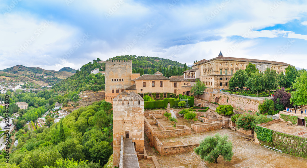 Alhambra. Panoramic view on alcazaba, palaces, mountains and old city. UNESCO heritage site. Granada, Andalusia, Spain